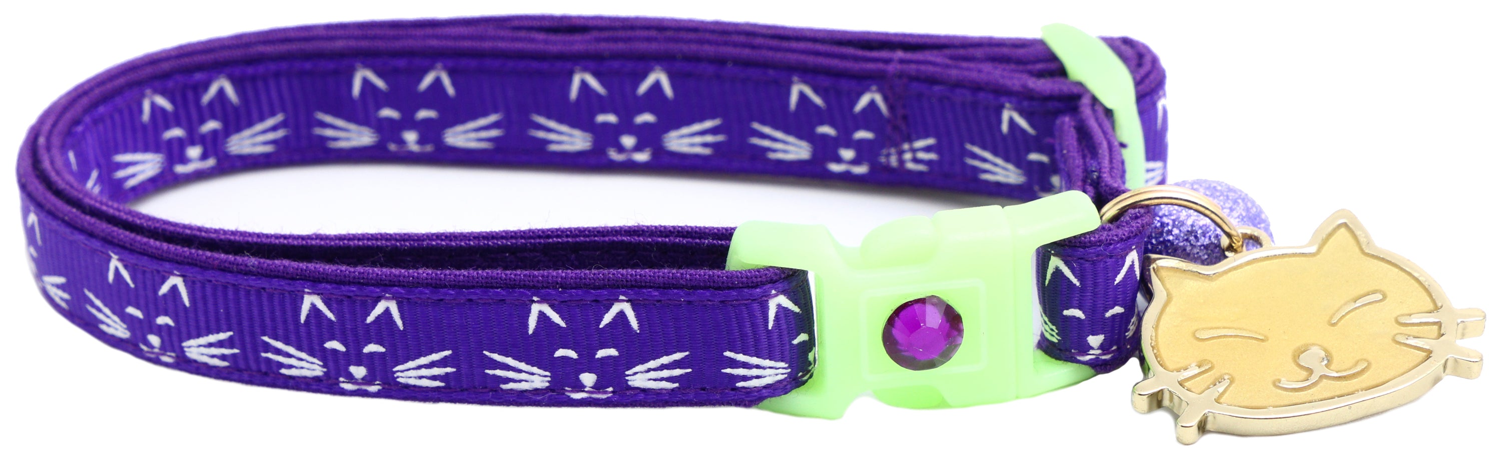 A glowing cat faces breakaway collar made of reinforced cotton, featuring a bell and charm, perfect for nighttime visibility.